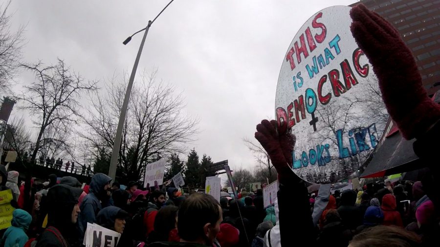 A+protester+at+the+January+21st+Womens+March+in+Portland+holds+up+a+mirror+that+reads%2C+This+is+what+democracy+looks+like.+The+rallies+attracted+around+100%2C000+participants%2C+easily+one+of+Portlands+largest.%C2%A0