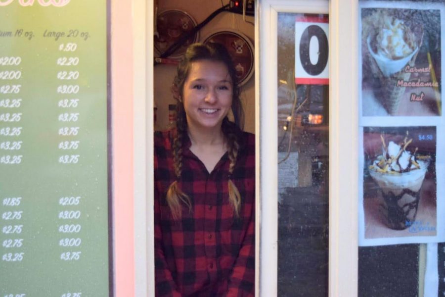 Piper Humphries serves up a smile and pep, along with customers coveted coffee, from her new business located in the senior lot. 