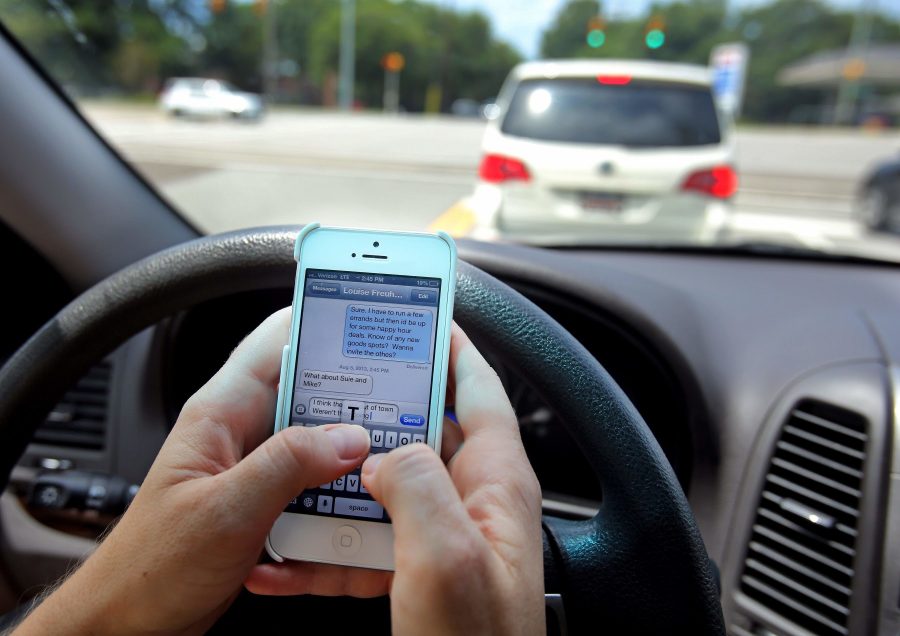 Driver+distracted+due+to+texting+while+at+the+wheel.