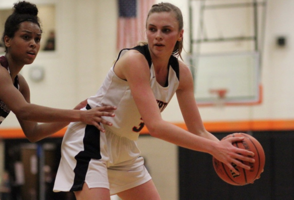 Sophomore Sydney Erikstrup looks to pass the ball to one of her teammates.