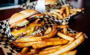 Every burger is topped with bacon and served with signature Killer Burger fries.