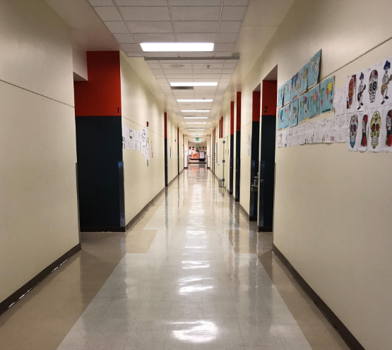 The main hallway in the Merle Davies building stretches on into oblivion, making it a challenge for some students to reach class on time.