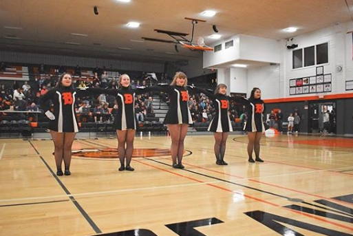 The team performs at an assembly.