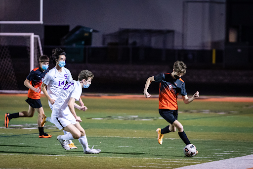 The Beaverton boys' soccer team battles Sunset in a game in April