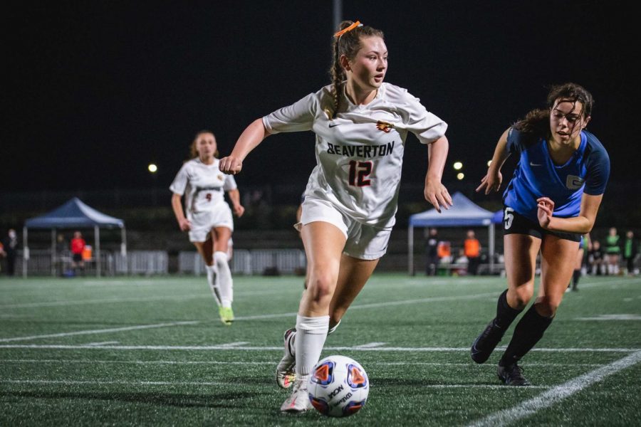 Roxanne Rundle chases the ball at Beaverton's championship game against Grant