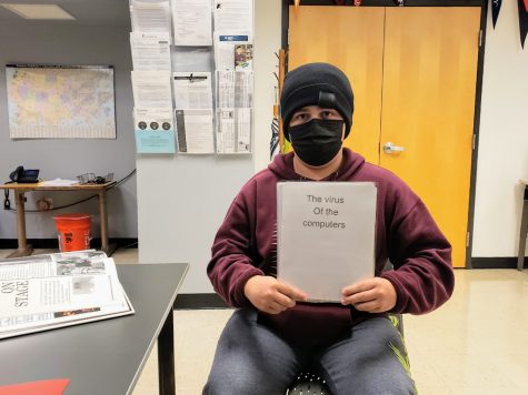 Parker displays one of his stories from 2020, The Virus of the Computers