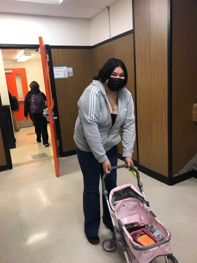 This freshman student drew attention with their toy baby carriage.
