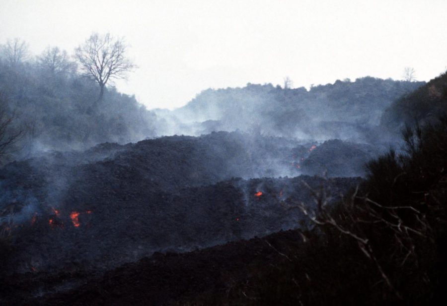 Lava flows down the slope of Mount Etna, which erupted recently in Italy