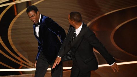 At the 2022 Oscars, Will Smith slaps Chris Rock on stage.